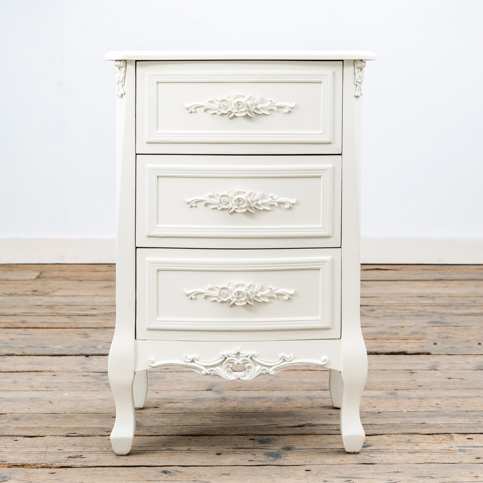 white ornate bedside tables